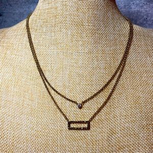 Lucky Brand double strand gold tone necklace with a rectangle charm and gem